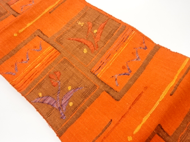 手織り真綿紬色紙に草花・抽象模様織出し名古屋帯